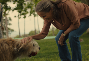 A person petting a dog AI-generated content may be incorrect.